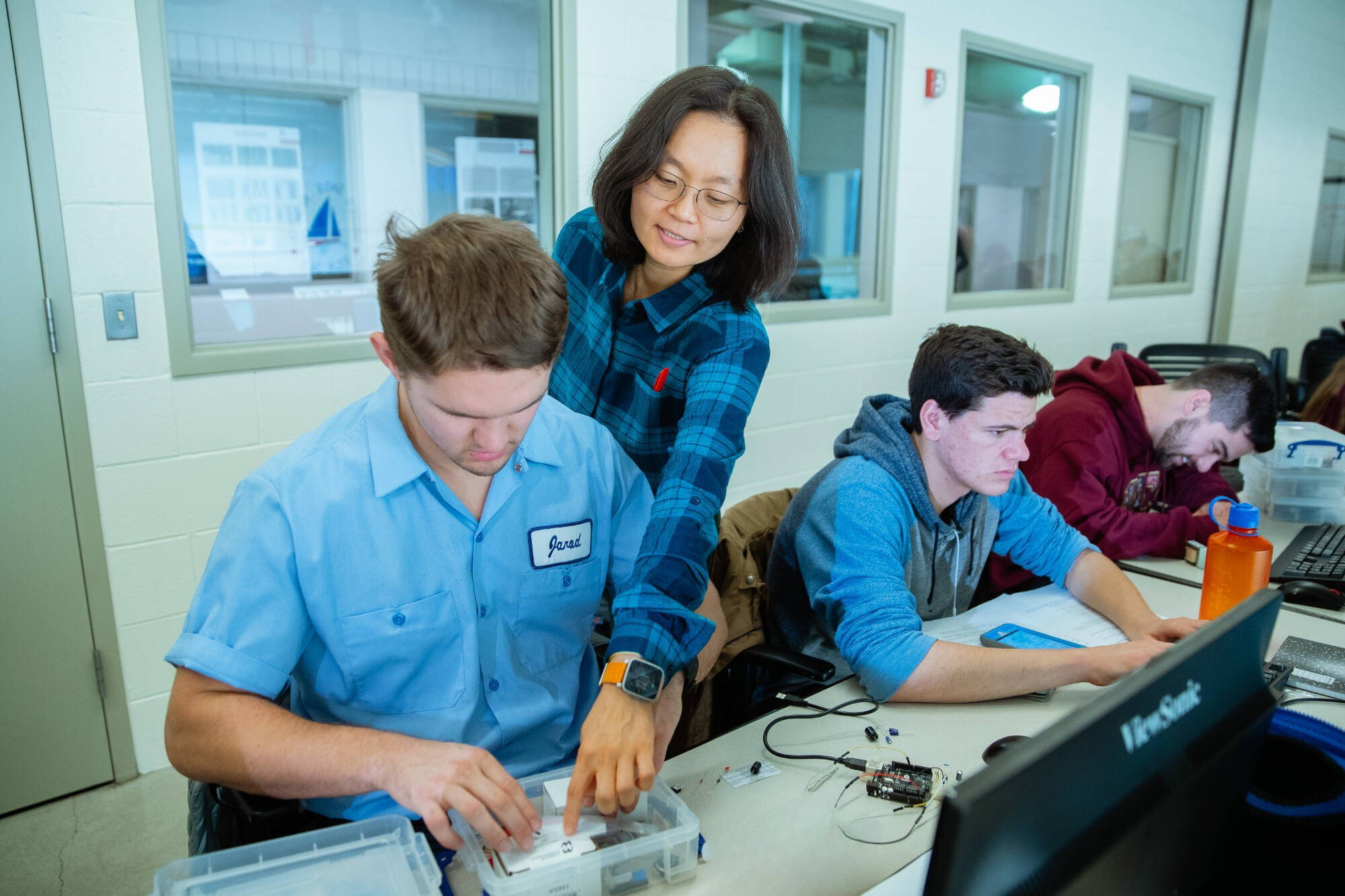 Dr Yunju Lee with students in a Lab